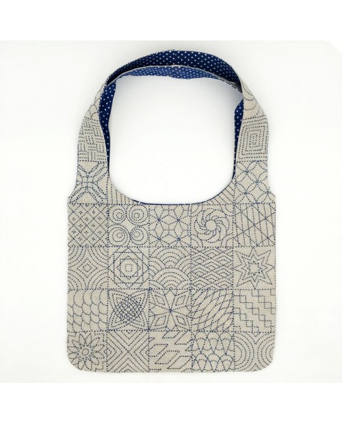 Handbag embroidered. Sashiko style embroidery on printed linen. To embroider and to sew. Design by Cecile Vessiere