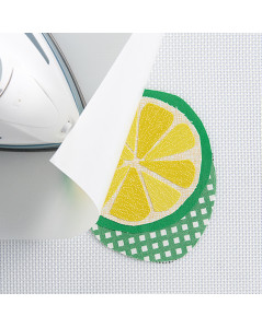 Place the pattern under the mat and assemble the fused pieces. Iron the pieces in place using the ironing sheet. Clover