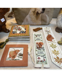 Accessories embroidered by cross stitch in the shop-window of our store. Le Bonheur des Dames, Textile Heritage Collection.