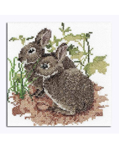 Picture embroidered in counted cross stitch. Two grey-brown rabbits in the grass. Thea Gouverneur G0572